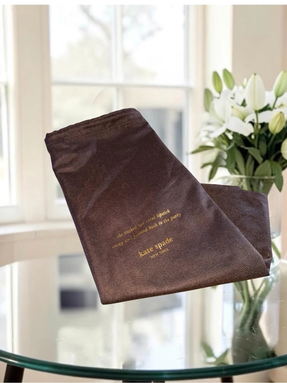 Kate Spade New York brown textured story book bust bag with gold writing 17x19